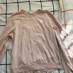 Pink Nike crew neck size large, but fits more like a medium